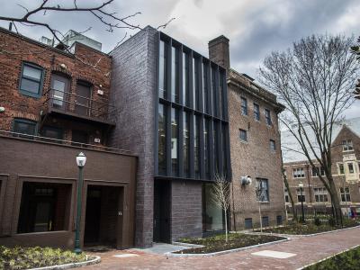 Exterior view of modern facade along brick pathway