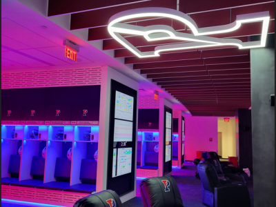 Pink and blue lit renovated Penn football locker room