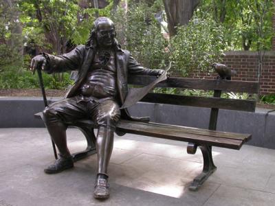 Ben Franklin statue sitting on a park bench